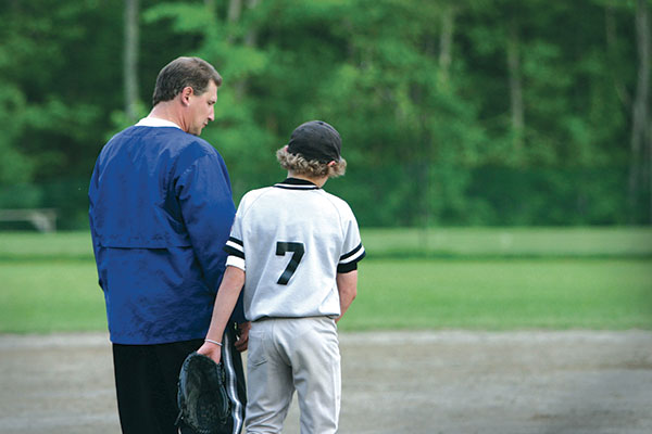 baseball coach with his player