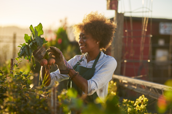 a woman gardening outside 