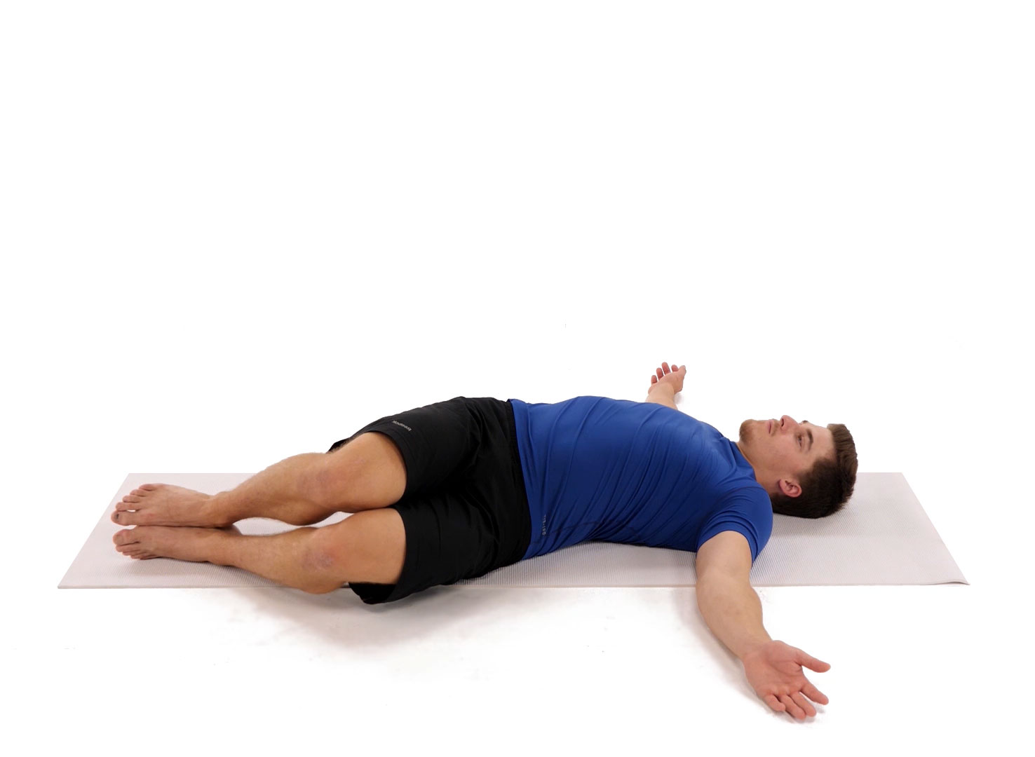 man relieving low back pain with low back rotation
